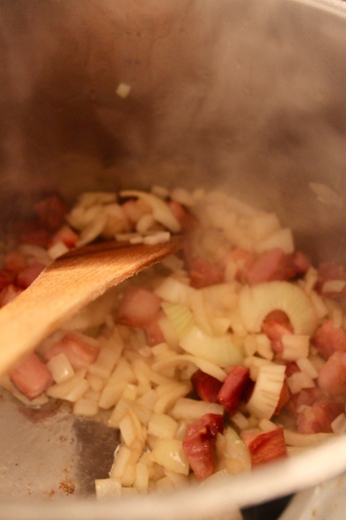 sauteeing onions and pork belly for lentil soup